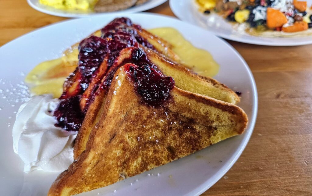 Drool-worthy French toast with berry compote and lemon curd, all housemade 