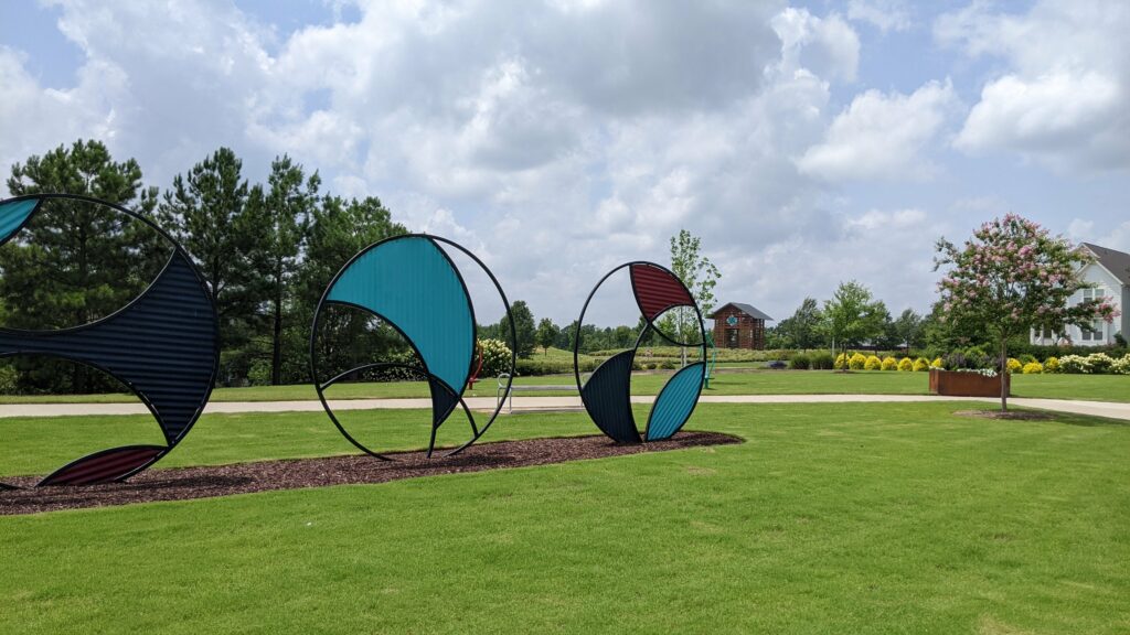 Public art in a park across the street from the cafe in the Wendell Falls planned community 