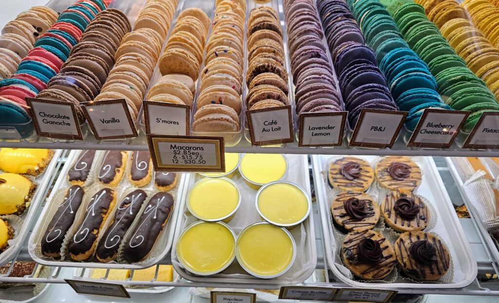 A colorful case at ??Ame?lie’s French Bakery & Cafe during a visit to ChristmasVille.