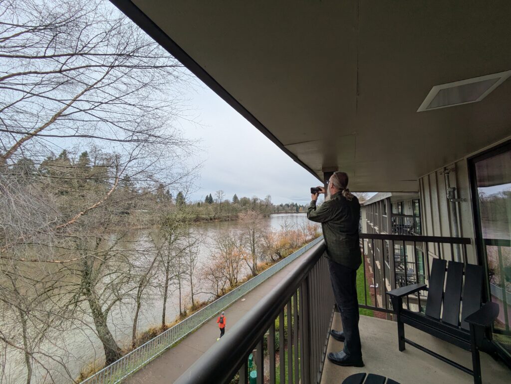 Patio view of Willamette River and riverfront bike trail at Valley River Inn in Eugene, Oregon. 