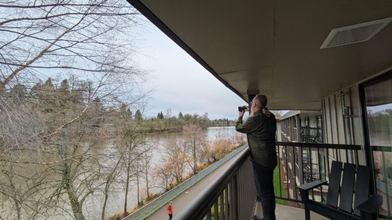 Patio view of Willamette River and riverfront bike trail at Valley River Inn in Eugene, Oregon.